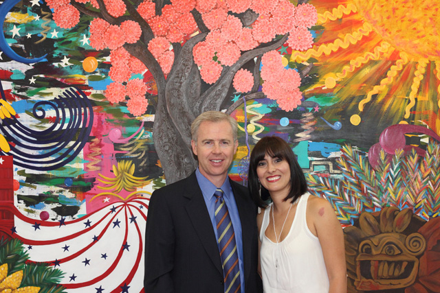 Craig and Yazmin in front of mural